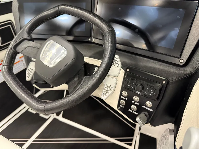 Slide: The Image of Steering wheel and dashboard of the 2024 Centurion Fi23 boat. - 15