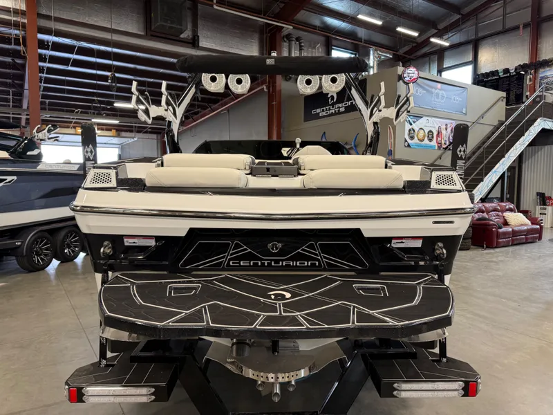 Slide: The Image of 2024 Centurion Fi23 boat in showroom, rear view. - 3