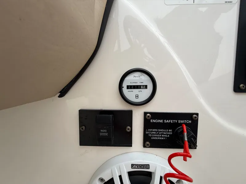 Slide: The Image of Dashboard of a 2008 Glastron GT 205 with safety and radio controls. - 12