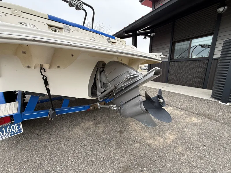 Slide: The Image of Rear view of a 2008 Glastron GT 205 boat with outboard motor. - 15