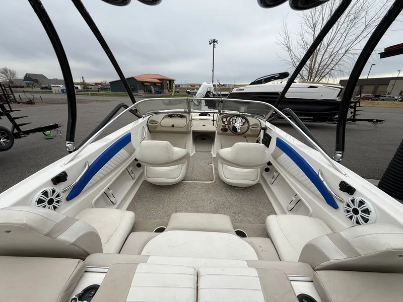 Slide: The Image of Interior of a 2008 Glastron GT 205 boat with white seating. - 8