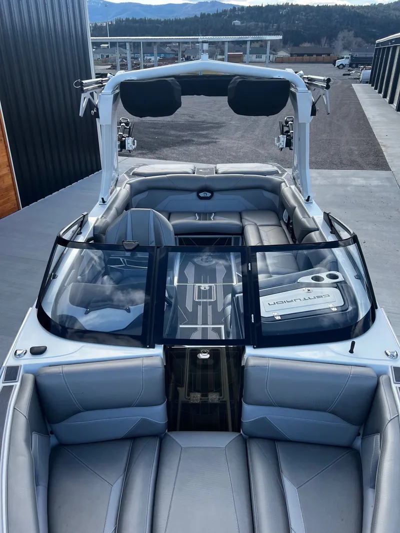 Slide: The Image of Interior of a 2023 Centurion Ri230 boat with gray seating. - 12
