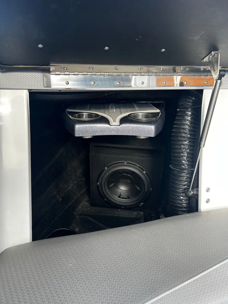 Slide: The Image of 2023 Centurion Ri230 boat with speaker and cup holder. - 14