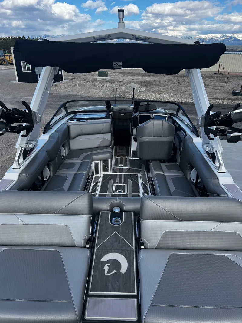 Slide: The Image of Interior of 2023 Centurion Ri230 boat with luxurious gray seating. - 15
