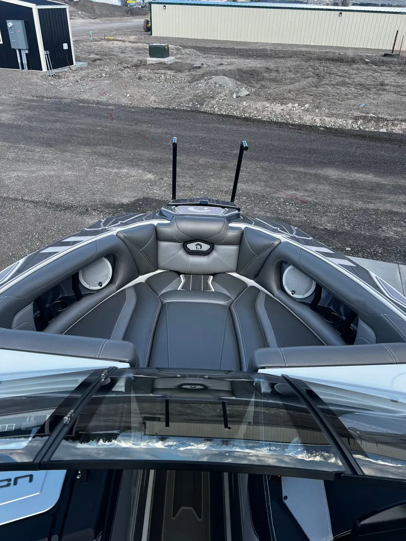 Slide: The Image of Interior of a 2023 Centurion Ri230 boat with gray leather seating. - 16