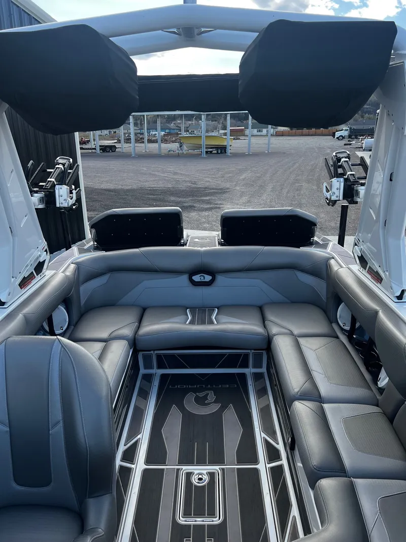 Slide: The Image of Interior of a 2023 Centurion Ri230 boat with gray leather seating. - 17