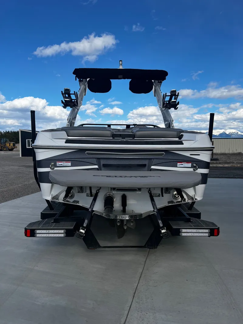Slide: The Image of Rear view of 2023 Centurion Ri230 boat on concrete surface. - 8