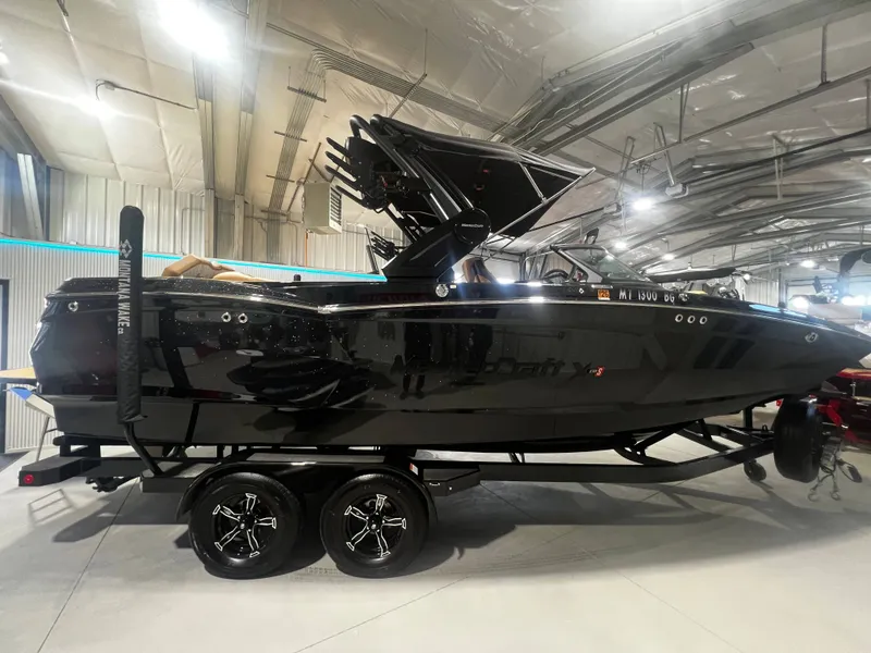 Slide: The Image of 2024 MasterCraft X STAR S boat in a storage facility. - 3