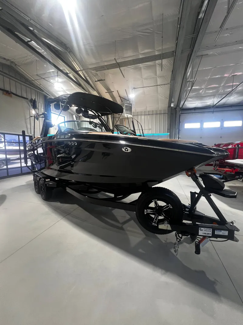 Slide: The Image of 2024 MasterCraft X STAR S boat in warehouse. - 4