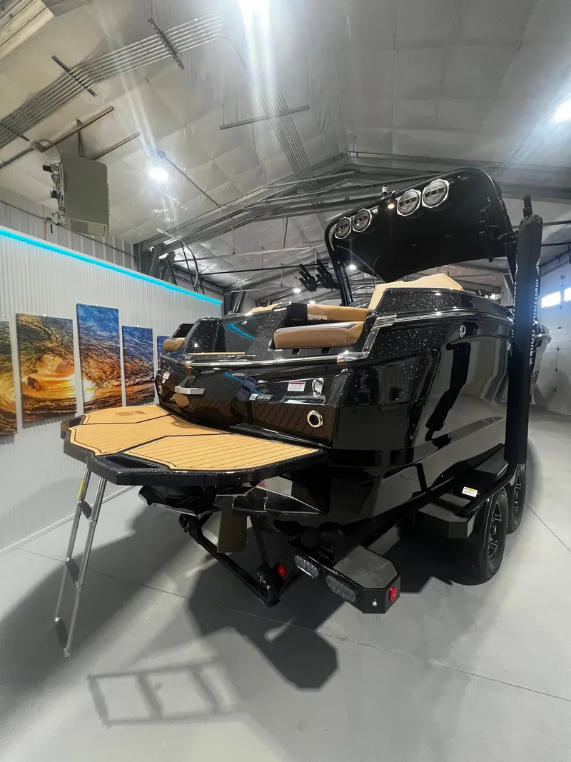 Slide: The Image of 2024 MasterCraft X STAR S boat in a showroom. - 5