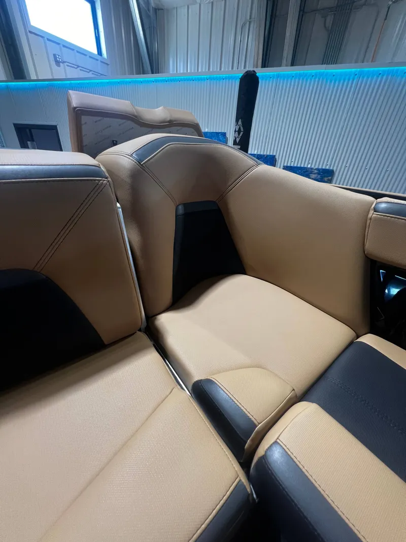 Slide: The Image of 2024 MasterCraft X STAR S boat interior, beige and black upholstery. - 8