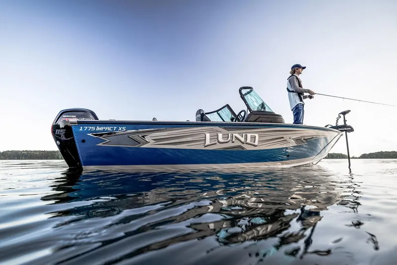 The Image of Manufacturer Provided Image: 2025 Lund 1775 Impact XS Sport boat on water with person fishing. - 0