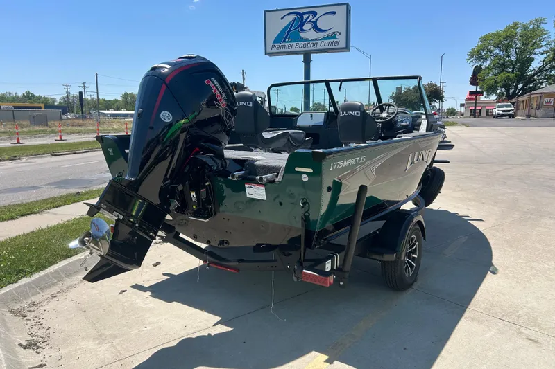 Slide: The Image of 2026 Lund 1775 Impact XS Sport boat on trailer at Premier Boating Center. - 13