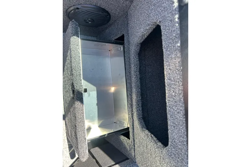 Slide: The Image of Open storage compartment in 2026 Lund 1775 Impact XS Sport boat interior. - 27