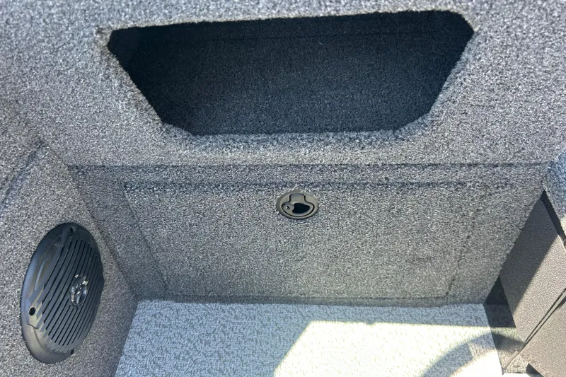 Slide: The Image of Interior view of 2026 Lund 1775 Impact XS Sport boat storage compartment. - 28