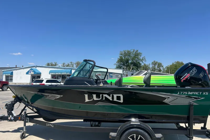 Slide: The Image of Manufacturer Provided Image: 2025 Lund 1775 Impact XS Sport boat interior with foldable ladder and fishing gear. - 35