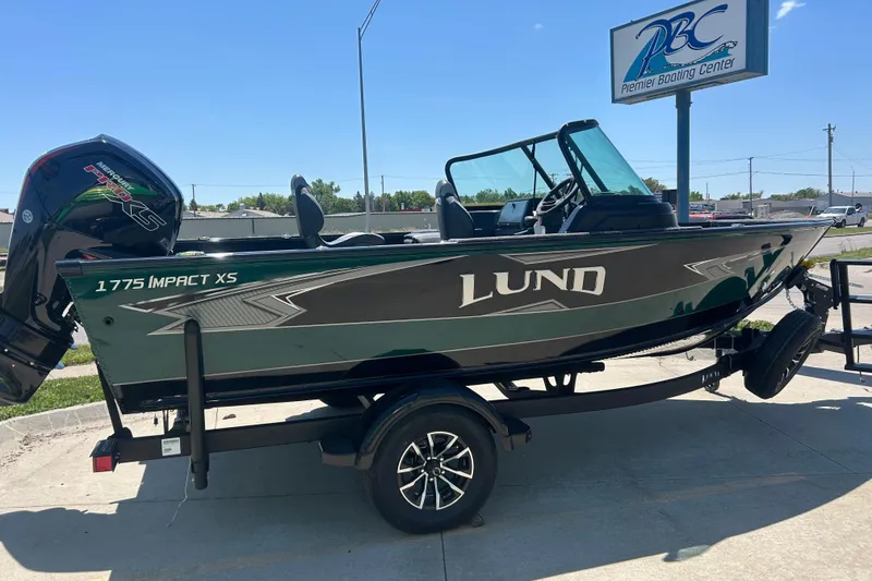 Slide: The Image of Manufacturer Provided Image: 2025 Lund 1775 Impact XS Sport boat on water with person fishing. - 39