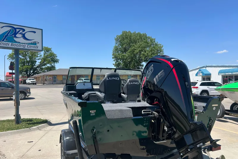 Slide: The Image of Manufacturer Provided Image: 2025 Lund 1775 Impact XS Sport boat interior with fishing rod storage. - 40