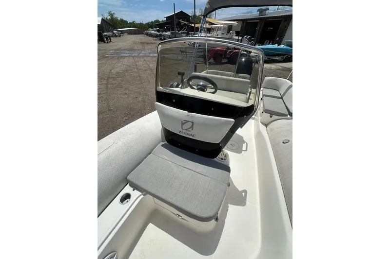 Slide: The Image of 2023 Zodiac N-ZO 680 boat interior with steering console and seating. - 12