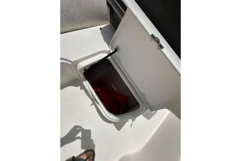Slide: The Image of Open storage compartment on 2023 Zodiac N-ZO 680 boat deck. - 13
