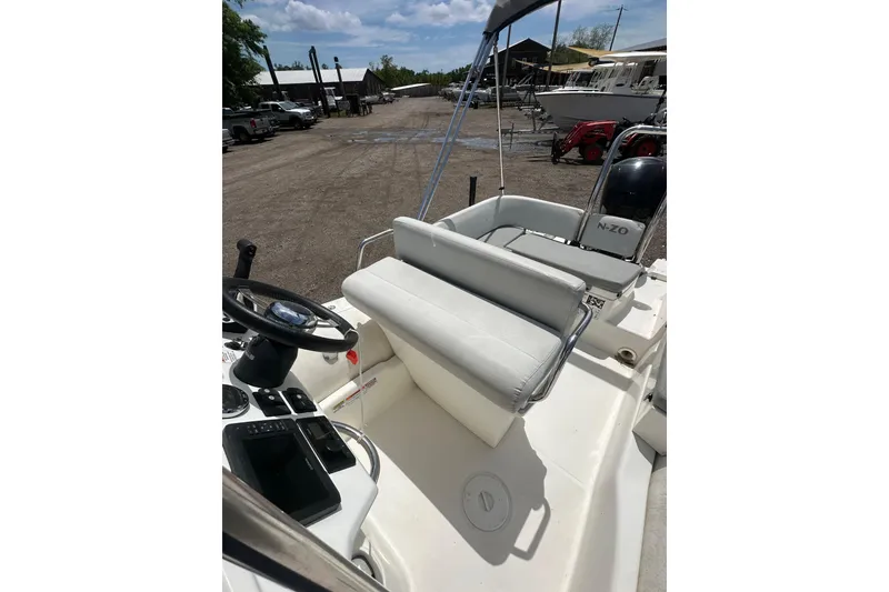 Slide: The Image of 2023 Zodiac N-ZO 680 boat interior with steering wheel and seating area. - 15