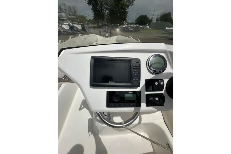 Slide: The Image of Control panel of 2023 Zodiac N-ZO 680 boat with Garmin navigation system. - 19