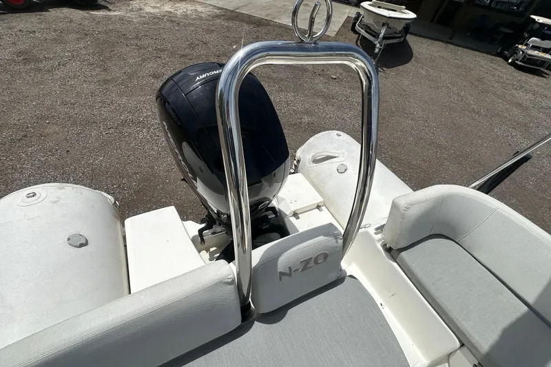Slide: The Image of 2023 Zodiac N-ZO 680 boat with Mercury outboard motor and sleek seating design. - 23