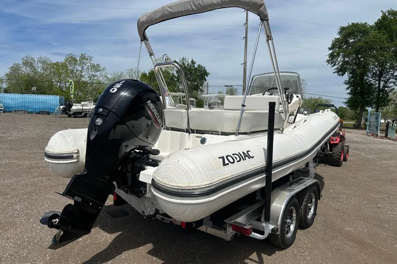 Slide: The Image of 2023 Zodiac N-ZO 680 boat on trailer with Mercury outboard motor. - 4