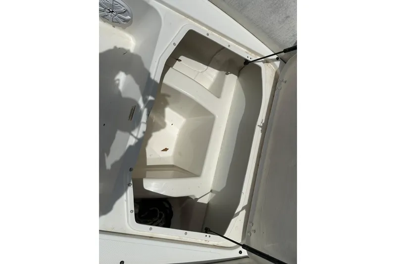 Slide: The Image of Open storage compartment on 2023 Zodiac N-ZO 680 boat, showing interior space. - 9