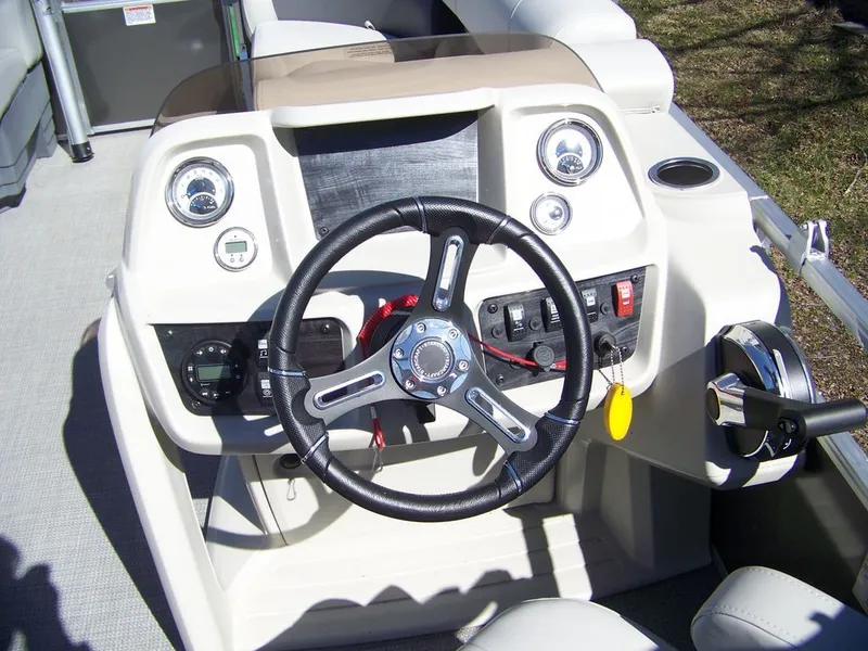 Slide: The Image of Steering console of the 2024 Starcraft LX 20 R boat. - 3
