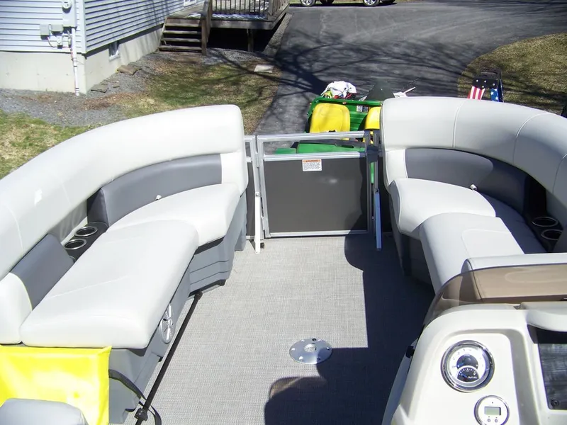 Slide: The Image of Interior of a 2024 Starcraft LX 20 R pontoon boat with seating. - 4