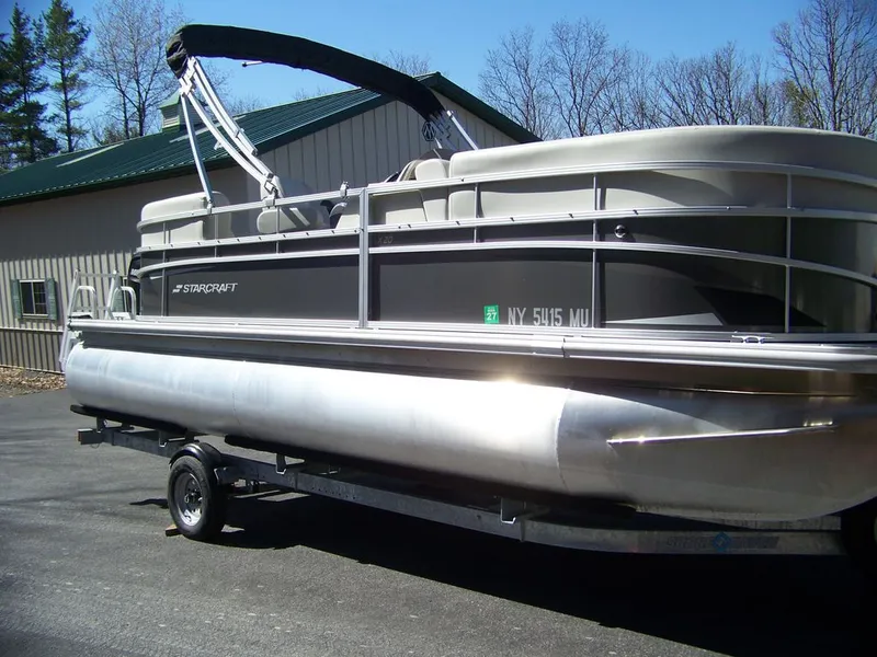 Slide: The Image of 2024 Starcraft LX 20 R pontoon boat on trailer. - 6