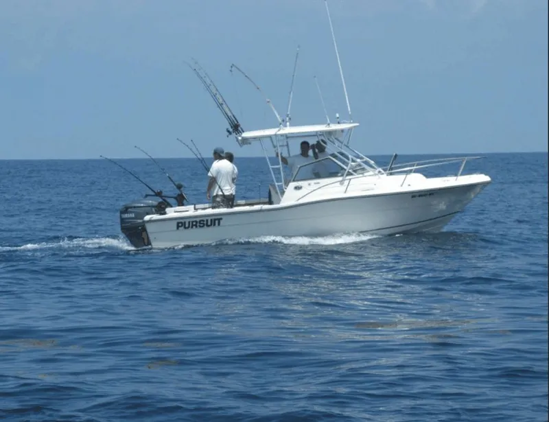 The Image of 1990 Pursuit 2350 boat on open sea fishing. - 0