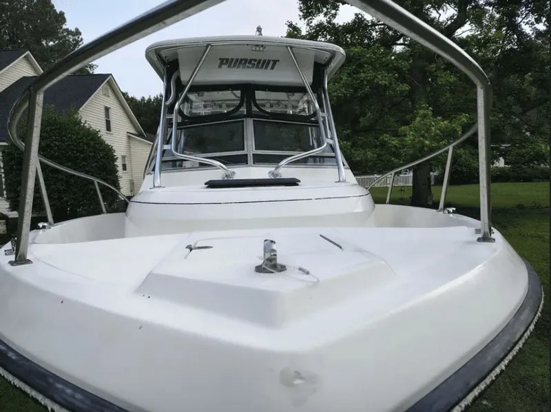 Slide: The Image of 1990 Pursuit 2350 boat in garden, front view. - 13