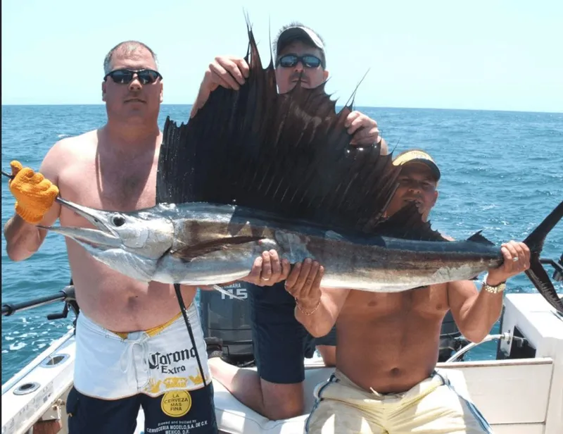 Slide: The Image of Three men holding a large sailfish on a boat. - 17