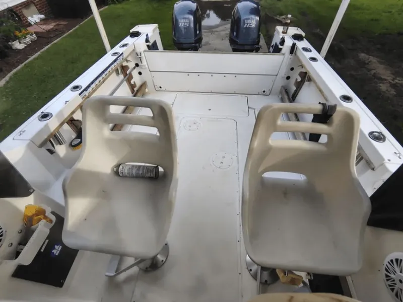 Slide: The Image of Interior of a 1990 Pursuit 2350 boat with two seats. - 9