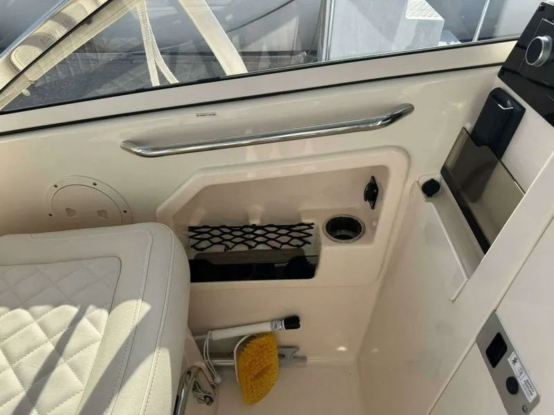 Slide: The Image of Interior of a 2022 Grady-White FREEDOM boat with seating and storage. - 13