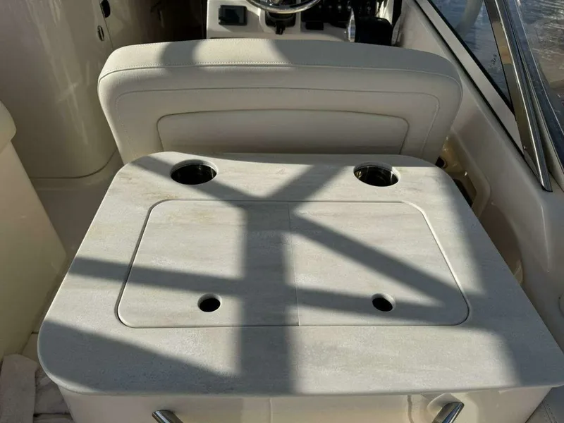 Slide: The Image of Grady-White FREEDOM 2022 boat seat with cup holders. - 15