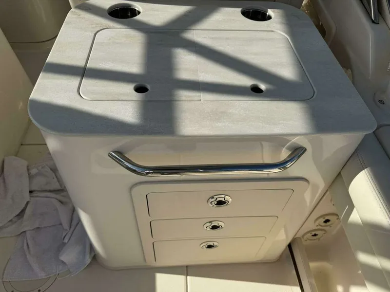Slide: The Image of Grady-White FREEDOM 2022 boat kitchenette with drawers and handle. - 16