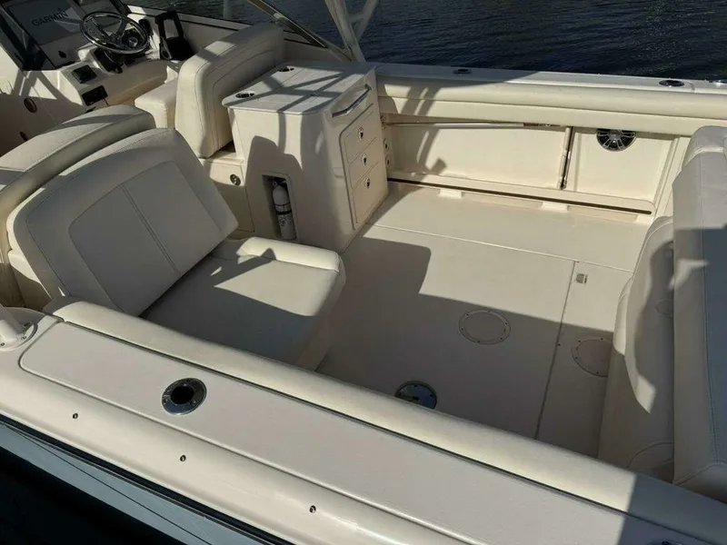 Slide: The Image of Interior of a 2022 Grady-White FREEDOM boat with beige seating. - 21