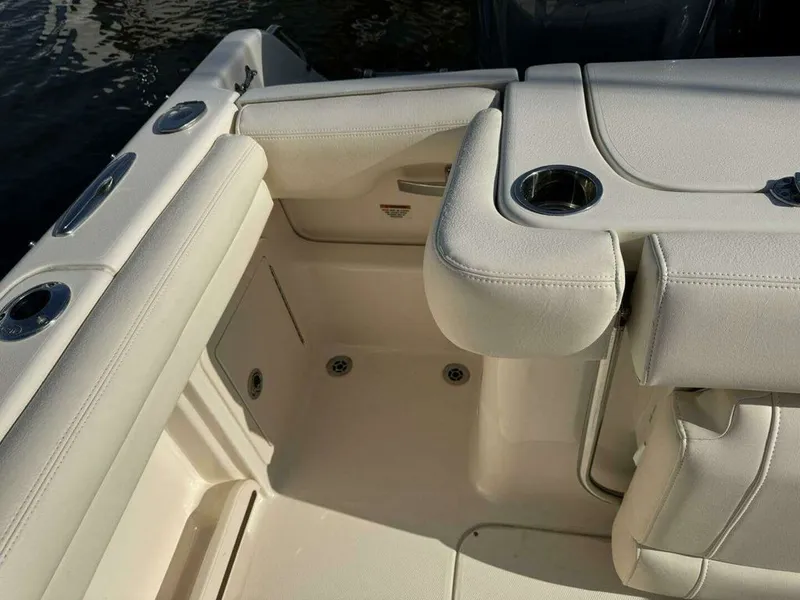 Slide: The Image of Interior of a 2022 Grady-White FREEDOM boat with beige upholstery. - 24