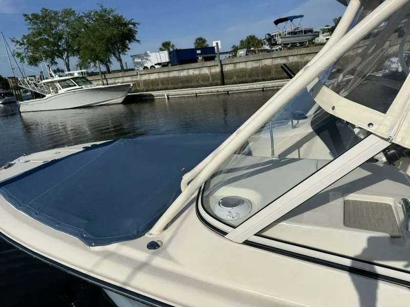 Slide: The Image of 2022 Grady-White FREEDOM boat docked on a sunny day. - 31