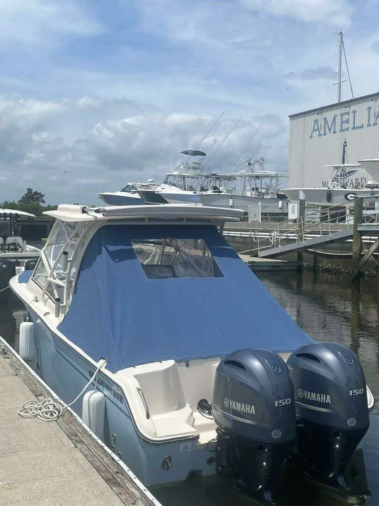 Slide: The Image of 2022 Grady-White FREEDOM boat with Yamaha engines docked at marina. - 34
