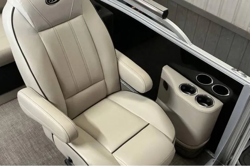 Slide: The Image of Luxurious beige captain's chair with cup holders in 2021 Barletta E24UC boat. - 6