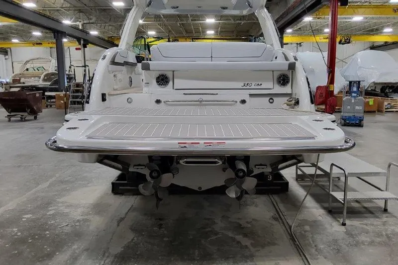 Slide: The Image of 2025 Formula 350 Crossover Bowrider I/O in a workshop, showcasing the rear deck and dual propellers. - 13