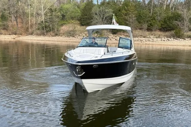 Slide: The Image of 2025 Formula 350 Crossover Bowrider I/O cruising on a calm lake. - 15