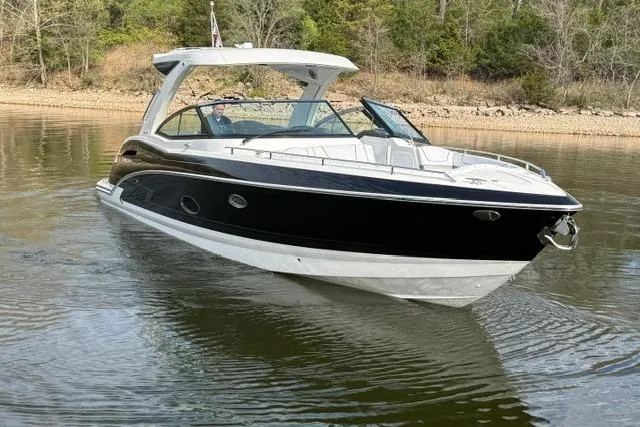 Slide: The Image of 2025 Formula 350 Crossover Bowrider I/O cruising on a calm lake. - 18
