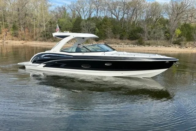 Slide: The Image of 2025 Formula 350 Crossover Bowrider I/O cruising on a calm lake. - 22
