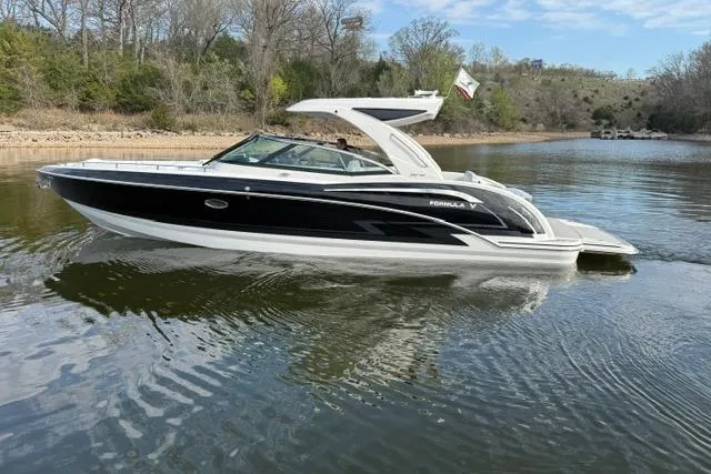 Slide: The Image of 2025 Formula 350 Crossover Bowrider I/O on a serene lake, showcasing sleek design and luxury. - 28