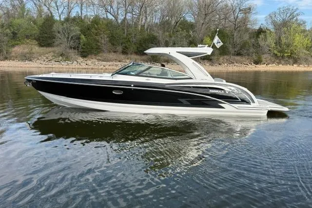 Slide: The Image of 2025 Formula 350 Crossover Bowrider I/O on calm lake waters. - 29